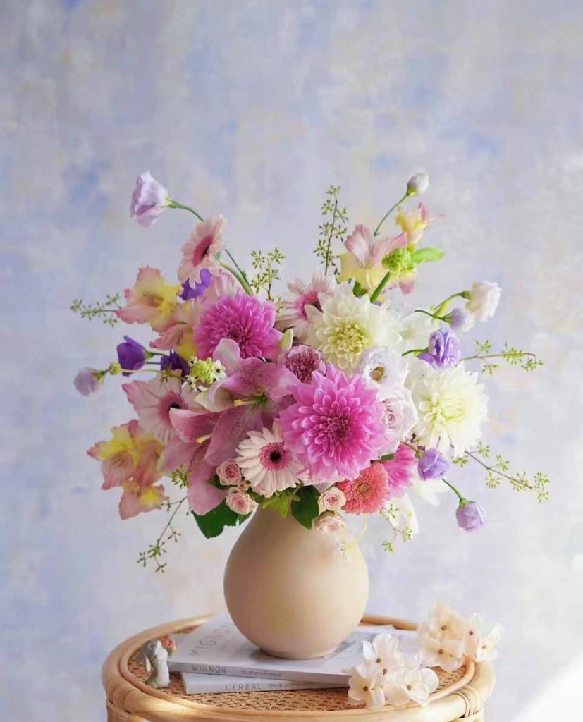 Modern interior scene with handmade custom porcelain vases from China on a small table.