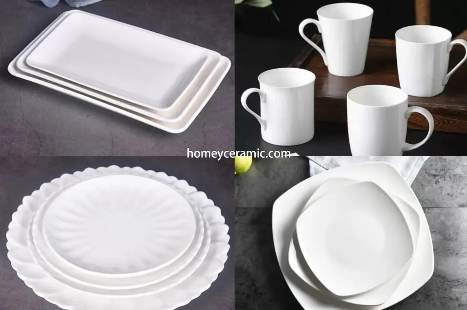 White functional ceramic tableware including mugs, plates, and rectangular serving dishes for everyday dining use.