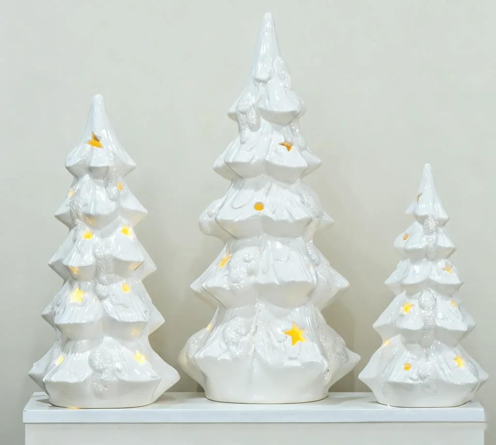 Ceramic Christmas tree with lights, a classic tabletop decoration for cosy holiday home styling.